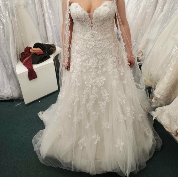 Brand new never used. VEIL NOT INCLUDED.